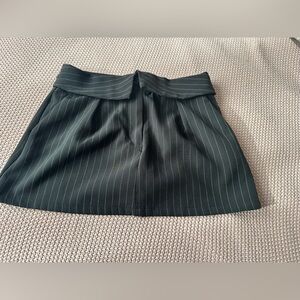 Elegant Black Pinstripe Women's Mini Skirt with undershort and pockets.